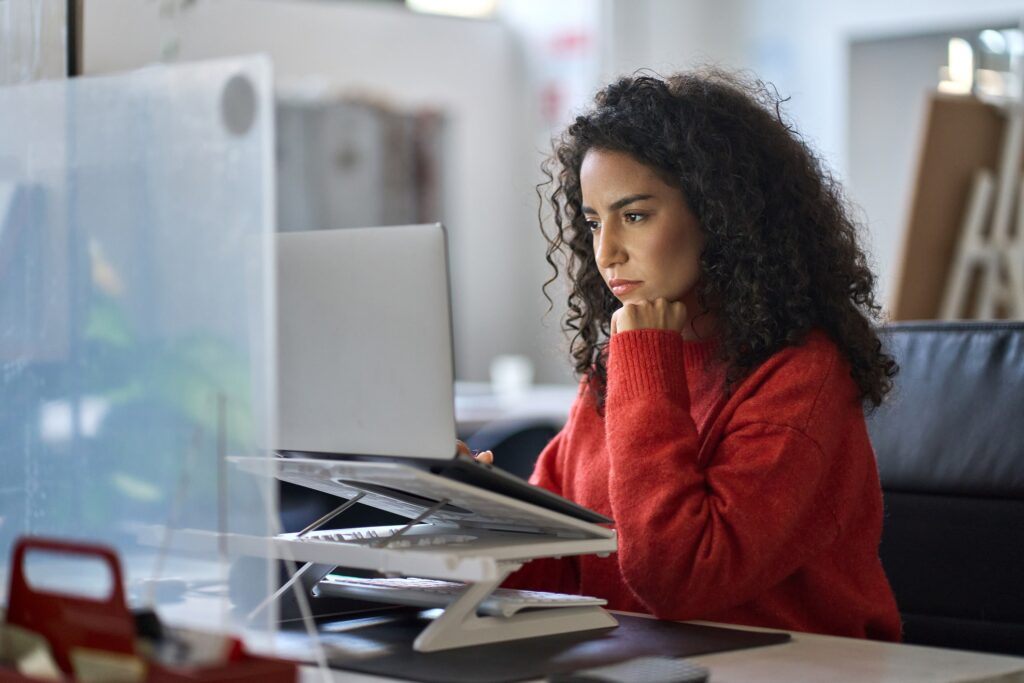 hispanic woman at computer